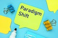 The photo says Paradigm Shift. Notepad, pen, marker