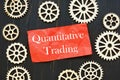 The photo says Quantitative Trading. Notepad, marker