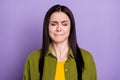 Photo of scared impressed young woman wear khaki outfit closed eyes biting lips isolated violet color background