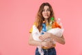 Photo of scared young woman holding plastic waste and looking at camera Royalty Free Stock Photo