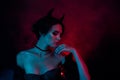 Photo of scary cruel dangerous lady satan look mystically gorgeous isolated on dark mist color background Royalty Free Stock Photo