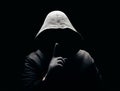 Scary man in hood showing silence sign Royalty Free Stock Photo