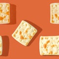 Photo seamless pattern of yellow-brown biscuits with shadows on a colored orange background.