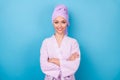 Photo of self-assured cute lady crossed hands white smile wear purple towel turban bath robe isolated blue color Royalty Free Stock Photo