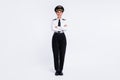Photo of self-assured successful girl fists folded arms wear aviator hat uniform shoes isolated white color background