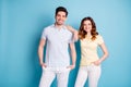 Photo of self-confident pair lean elbow shoulder best managers wear casual t-shirts white pants trousers isolated blue