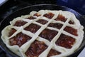 Semi-finished Apple pie on a frying pan Royalty Free Stock Photo