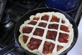 Semi-finished Apple pie on a frying pan Royalty Free Stock Photo