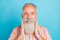 Photo of senior man happy positive smile hands touch beard barber shop haircare over blue color background