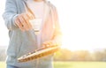 Midsection of senior man with shuttlecock and tennis racket in park Royalty Free Stock Photo