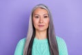 Photo of senior pretty woman clever long hair focused manager agent over violet color background