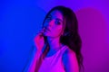 Photo of sensual beautiful stunning good looking young lady posing on camera on neon blue color background