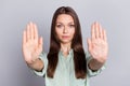 Photo of serious brunette lady show no arms wear blue blouse isolated on grey color background Royalty Free Stock Photo