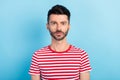 Photo of serious calm handsome young man wear casual clothes casual outfit isolated on blue color background