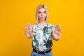 Photo of serious confident lady wear print shirt showing arms palms stop isolated yellow color background