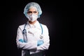 Photo of serious infection doc professional arms crossed look empty space wear medical stethoscope lab coat facial mask Royalty Free Stock Photo