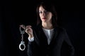 Photo serious woman with pair of handcuffs