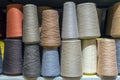 Set of colored threads for sewing on coils. Pile of big colorful spools of thread. Colored thread spools of thread large class, Royalty Free Stock Photo