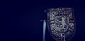 Photo of shield knight armor and sword over dark background. Medieval period concept Royalty Free Stock Photo