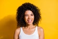 Photo of shiny adorable young dark skin lady wear white singlet winking isolated yellow color background Royalty Free Stock Photo