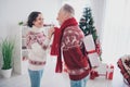 Photo of shiny charming age couple dressed print pullovers presenting gifts smiling indoors room home house Royalty Free Stock Photo