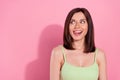 Photo of shiny cunning young girl dressed green outfit licking lips looking empty space isolated pink color background Royalty Free Stock Photo