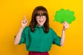 Photo of shiny excited woman dressed green shirt pointing finger mind bubble empty space isolated yellow color Royalty Free Stock Photo