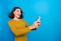 Photo of shiny excited woman wear shirt chatting instagram twitter telegram facebook empty space isolated blue color Royalty Free Stock Photo