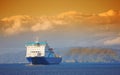 A photo of ship, Sunset, ocean and mountains