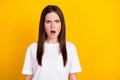 Photo of shocked amazed crazy scared afraid woman hear unexpected news information isolated on yellow color background