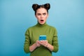 Photo of shocked crazy teen lady open mouth browsing telephone read blog negative post comments bad mood wear green Royalty Free Stock Photo