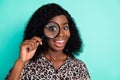 Photo of shocked funny lady hold loupe enlarge eye wear leopard print shirt isolated teal color background