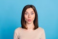 Photo of shocked nice young lady pouted lips cant believe isolated on blue color background