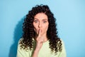 Photo of shocked speechless lady finger close lips look camera wear green sweater isolated blue background