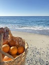 photo shoot with Basket oranges beach Royalty Free Stock Photo