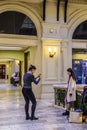 Photo shoot of beautiful girls in the main department store GUM. Red square, building 3. Moscow, Russia. Royalty Free Stock Photo