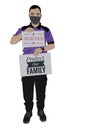 Photo show a man holding card board with written text IM VACCINATED and PROTECT OUR FAMILY on white background. 3D ilustration.