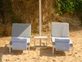 Beach hammocks, hotel relaxation area on beach sand Royalty Free Stock Photo