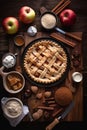 Apple pie and its ingredients on the table close-up