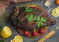 Large river smoked fish without a head lies on a cutting board Royalty Free Stock Photo