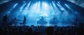 The photo shows a live music concert with the band illuminated by bright stage lights Royalty Free Stock Photo