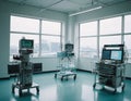 The photo shows medical equipment monitors that monitor vital functions, an infusion pump and a medical cart with instruments.