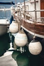 Photo of side of the ship with big white buoys Royalty Free Stock Photo