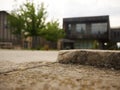 Photo of a sidewalk in the foreground with a deserted city in the background during containment