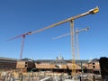 Silent Construction Cranes on a Clear Day