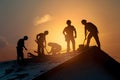 Photo Silhouette construction workers on building roof, showcasing labor Royalty Free Stock Photo