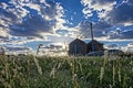Silo at sunrise with blue sky with clouds Royalty Free Stock Photo