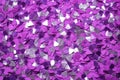 photo of silver glitter scattered on a vibrant purple surface