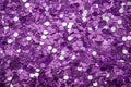 photo of silver glitter scattered on a vibrant purple surface