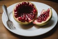 A single pomegranate split open, revealing ruby seeds Royalty Free Stock Photo